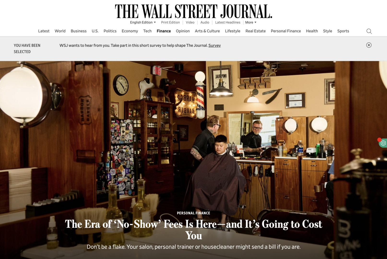 Cover of Wall Street Journal article showing image of Greg Krugga cutting someone's hair